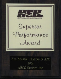 A wooden plaque with the words superior performance award.