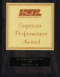 A wooden plaque with the words superior performance award.