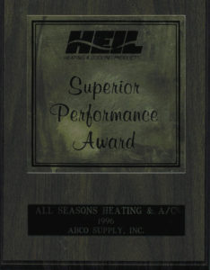 A wooden plaque with the words superior performance award.