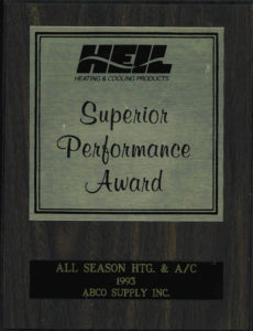 A wooden plaque with the words superior performance award.